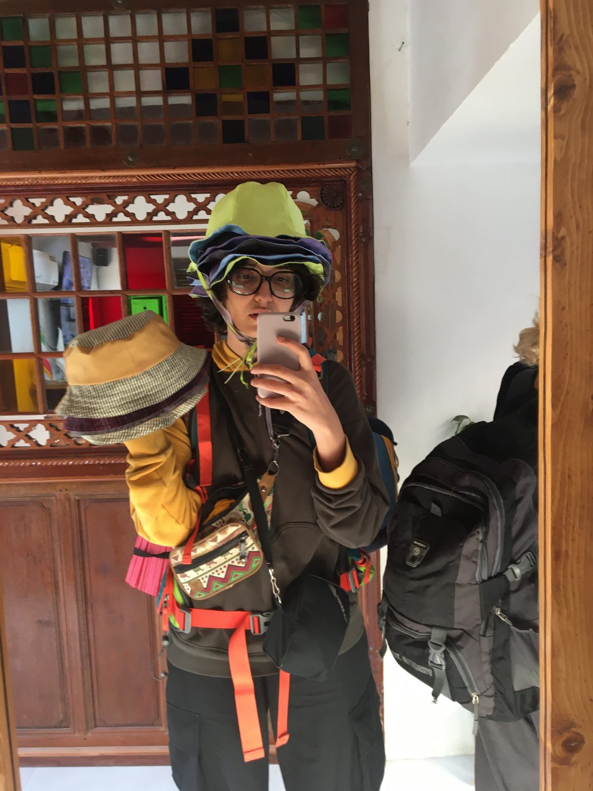 Fitting session with hats and orange straps in a traditional interior