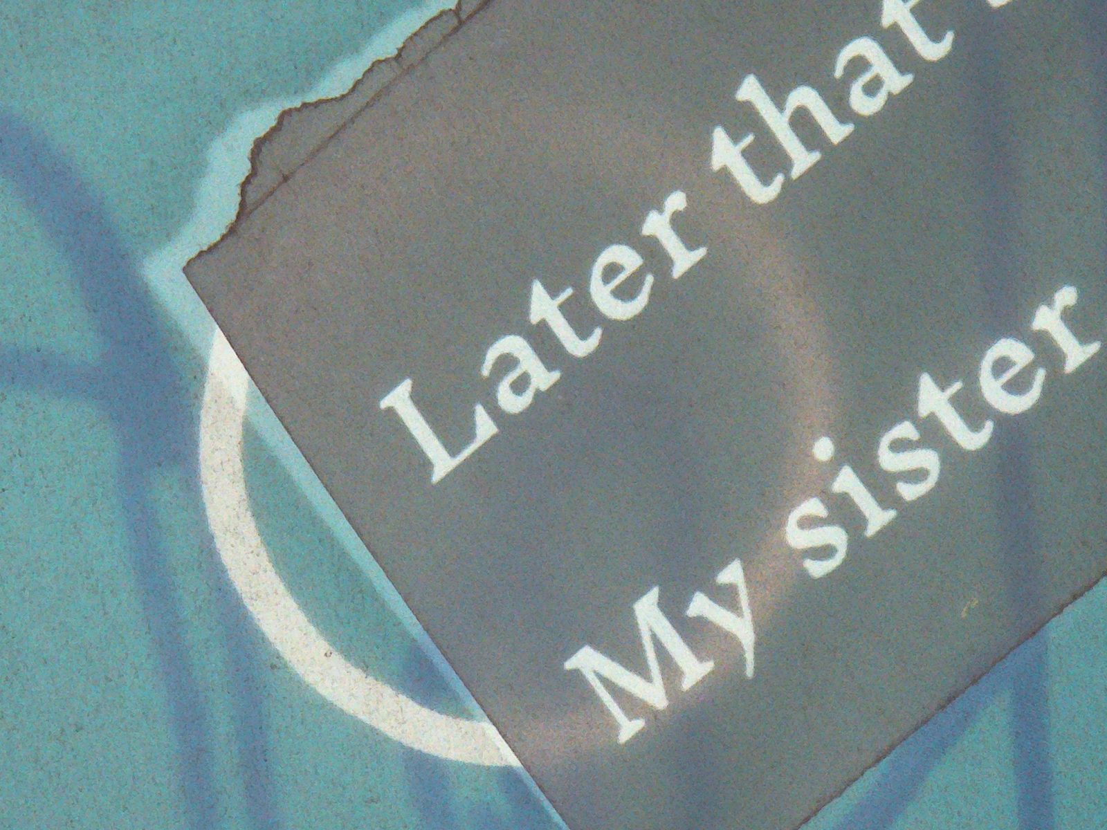 Torn paper fragments reading Later that and My sister on a green page