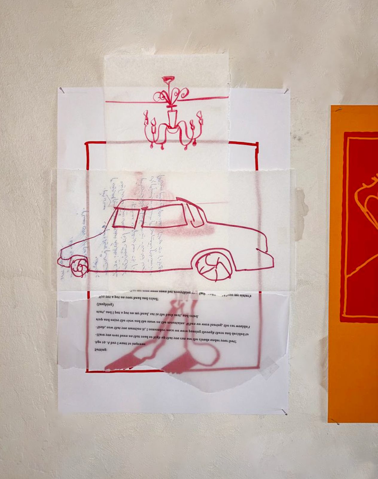 Red stitched drawing of a car with a chandelier above it