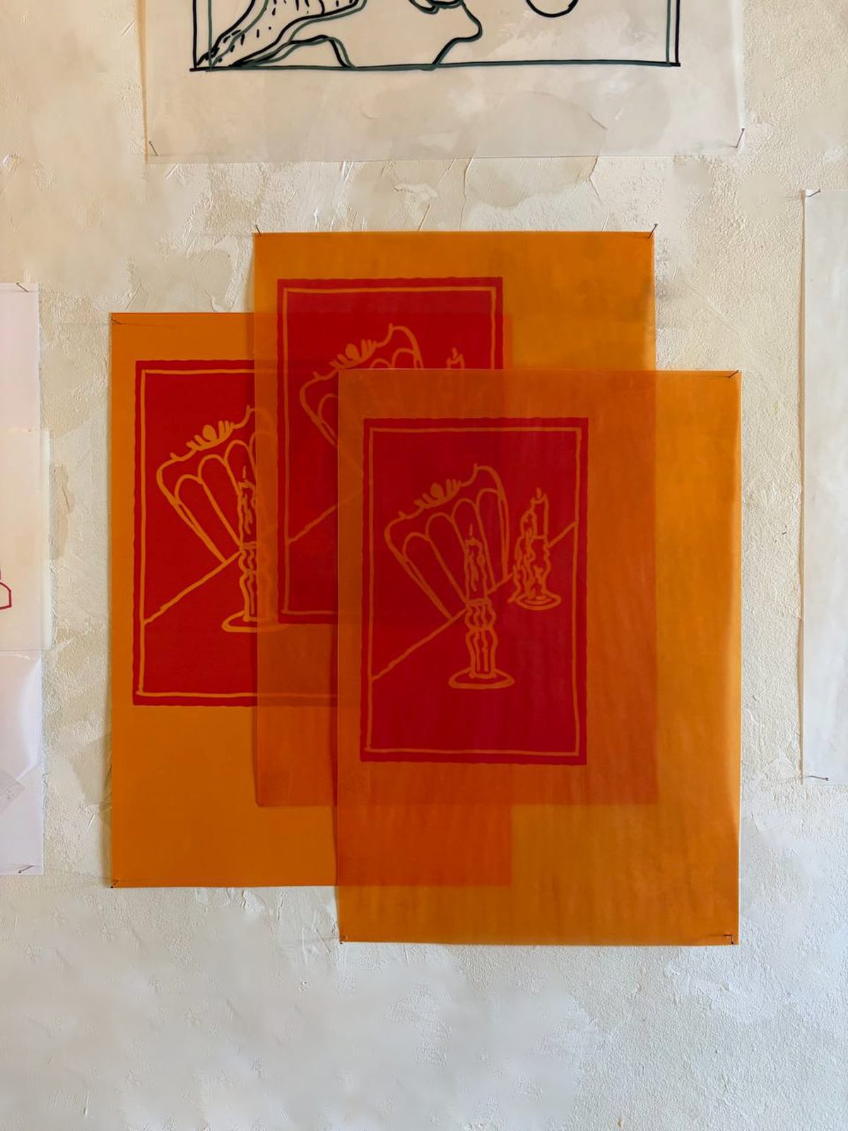 Layered translucent orange and red prints of hands holding tulips