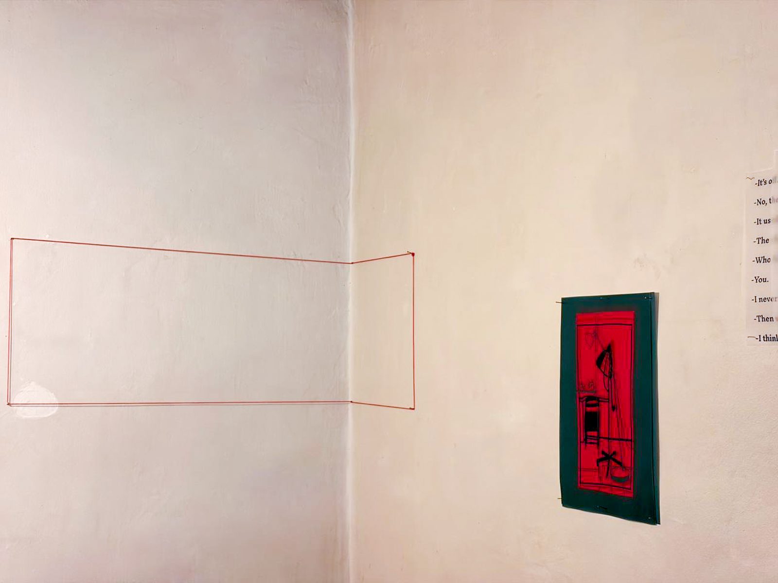 Small red framed work beside an empty stitched outline on the wall