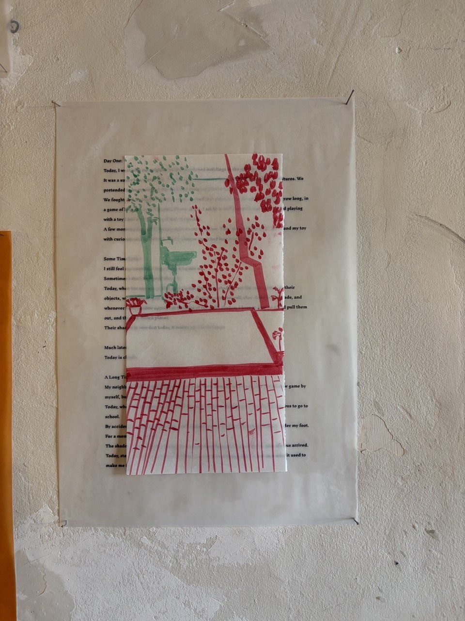 Green and red stitched print of a lamp pinned to the wall